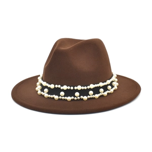 Close-up of a dark brown wool fedora hat featuring a stylish pearl beaded hatband detail