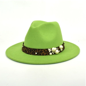 Detail of lime green fedora hat featuring leopard print band with pearl accents