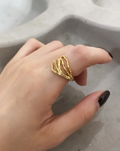 Detail of gold minimalist textured ring featuring an irregular branch-like organic design