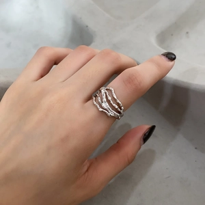 Macro view of minimalist 925 sterling silver multi-layer ring with irregular branch texture