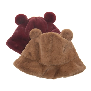 Detail of plush winter bucket hats with bear ears in deep red and brown faux fur texture