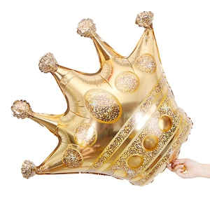 Large golden crown foil balloon with glitter details for birthday party decorations