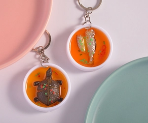 Detailed macro shot of creative PVC food miniature keychains featuring fish and turtle models