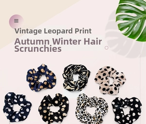 Detail of 7 leopard and polka dot print scrunchies in velvet fabric on pink background