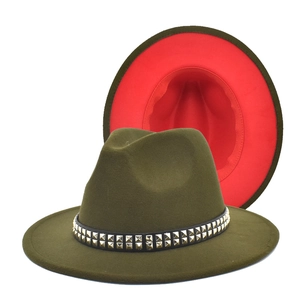 Detail of olive green fedora with red lining and golden studded leather band decoration
