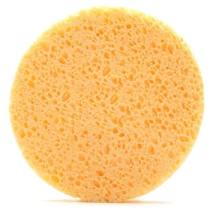 Natural yellow wood pulp sponge in round shape for facial cleansing and exfoliating