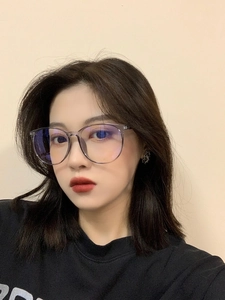 Close-up of trendy oversized anti-blue light glasses worn by a female model
