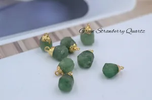 Macro detail of natural green strawberry quartz pendants with gold-plated caps
