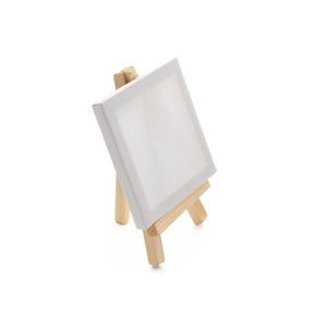 Close-up of a mini wooden tripod easel with a small blank white square canvas frame