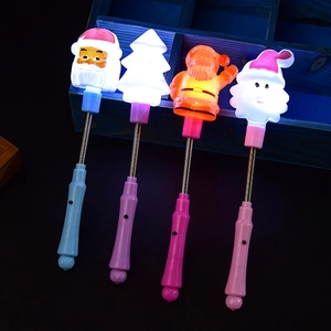 Luminous Christmas glow sticks featuring Santa and tree motifs with bouncy metal springs