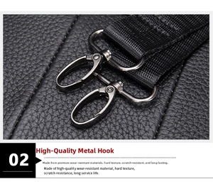Close-up of durable dark grey metal swivel hooks and black nylon woven shoulder strap