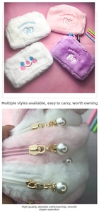 Detail of plush cosmetic bag with pearl zipper pendant and dog embroidery