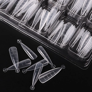 Close-up of clear dual nail forms with scale lines and size numbers in a plastic box