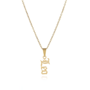 Close-up of polished gold Leo zodiac necklace pendant with a reflective finish