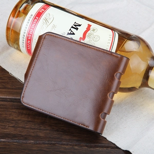 Close-up of brown leather texture and stitching detail on a tri-fold men's wallet