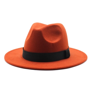 Detail of orange wool fedora hat featuring a stylish black decorative band and flat brim