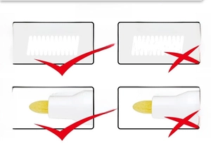 Close-up of yellow fiber tip and white ink stroke consistency on smooth surface