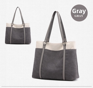 Detail of gray canvas tote bag with contrast cream stitching and large storage capacity