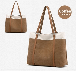 Detailed close-up of a coffee and white vintage canvas tote bag with brown leather handles