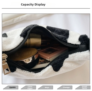 Detail showing the internal capacity of the zebra pattern plush bag with cosmetics