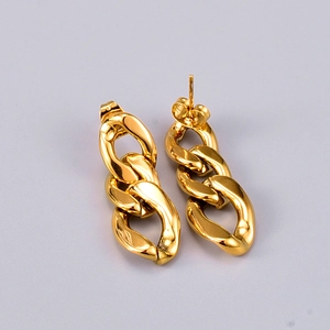 Macro detail of chunky gold-plated chain hoop earrings with high-polished mirror finish
