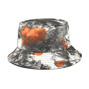 Detail view of double-sided graffiti bucket hat showing dense stitching and canvas texture