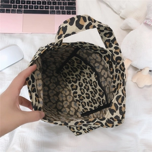 Detail showing spacious interior with a secure zipper pocket in leopard print tote bag