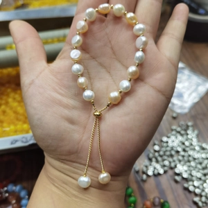Detail of baroque freshwater pearl bracelet with 14k gold-filled chain and slider clasp