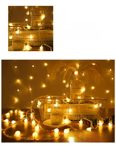 Detail view of round LED warm light bulbs in a cozy indoor home decor arrangement