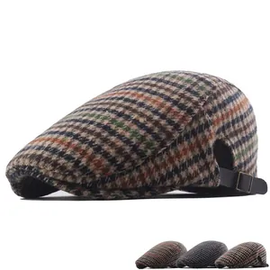 Vintage houndstooth pattern newsboy cap with adjustable leather strap and metal buckle