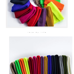 Detailed view of colorful ribbed knit beanies in various vibrant fashion colors