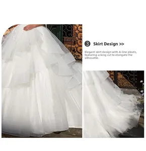 Detail of layered white tulle wedding dress skirt with elegant pleated A-line silhouette