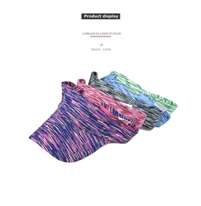 Detail of colorful striped sports sun visors with breathable cotton fabric texture