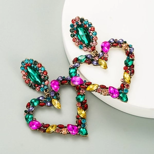 Detail of bohemian heart earrings featuring colorful rhinestones on a gold alloy base