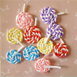Close-up of colorful spiral resin lollipops for DIY crafts and hair accessories