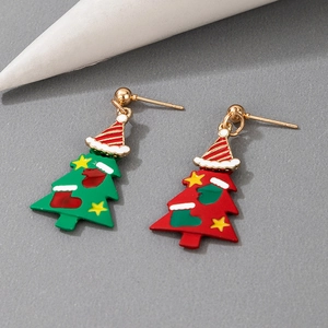 Detail of Christmas tree drop earrings with red and green colors and striped holiday hats