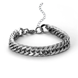 Detailed view of silver Cuban link chain with lobster clasp and extension chain length