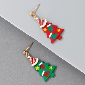 Close-up of festive Christmas tree earrings with colorful enamel charms and golden studs