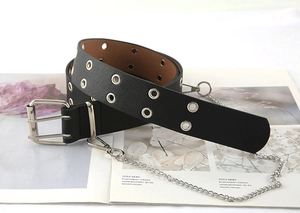 Detail of black punk waist belt featuring double metal eyelets and silver decorative chain