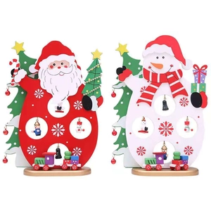 Close-up of wooden Christmas ornaments featuring Santa and snowman with hanging mini trains