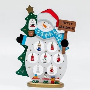 Handcrafted wooden snowman and Christmas tree tabletop ornament with Merry Christmas sign