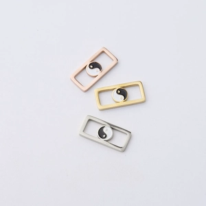 Detailed view of rectangular mirror stainless steel charms in rose gold, gold and silver