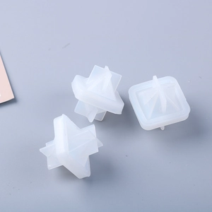 Top view of three white translucent silicone cross molds for resin casting DIY crafts