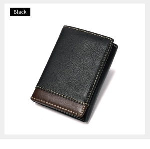 Detail of RFID-blocking men's leather wallet featuring black and brown contrast stitching