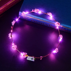 Luminous pink rose flower crown with purple LED lights on brown vine headband