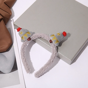 Detail showing grey fuzzy headband with mini party hats, red pom-poms and gold embroidery