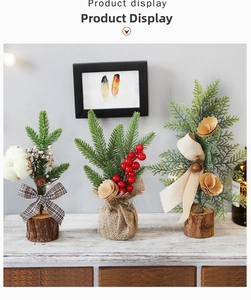 Detailed view of three 25cm pine needle mini Christmas trees with pinecones and red berries