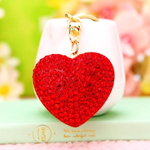 Detail of red rhinestone heart keychain with gold link chain and lobster clasp