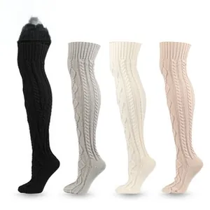 Detailed cable-knit texture of thick over-the-knee winter socks in four neutral colors