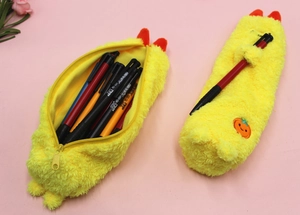 Detail showing plush yellow pencil case with soft texture and cute embroidery details